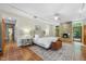 Bright main bedroom with fireplace, terracotta tile flooring and access to backyard at 213 Chimeneas Pl, Chapel Hill, NC 27517