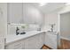 A mudroom with lots of storage, a sink and tile floors at 213 Chimeneas Pl, Chapel Hill, NC 27517