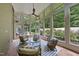Sunroom featuring tile floors, neutral colors and multiple chairs at 213 Chimeneas Pl, Chapel Hill, NC 27517