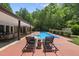 Lounge by the pool on two chairs and enjoy the backyard at 213 Chimeneas Pl, Chapel Hill, NC 27517