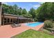 Backyard pool and patio area, perfect for relaxation and outdoor entertaining at 213 Chimeneas Pl, Chapel Hill, NC 27517