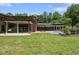 Beautiful backyard showcasing a sleek pool, brick patio, and landscaped surroundings, ideal for summer relaxation and entertaining at 213 Chimeneas Pl, Chapel Hill, NC 27517