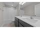 Bathroom with double vanity, sleek countertops, and tiled floor at 2177 Campbell, Burlington, NC 27215