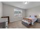 Cozy bedroom with a single bed, carpeted floor, and natural lighting at 2177 Campbell, Burlington, NC 27215