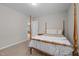 Bedroom with carpet, neutral walls, and a four-poster bed at 2177 Campbell, Burlington, NC 27215