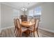 Traditional dining room with wood table and chairs and natural light from large windows at 2177 Campbell, Burlington, NC 27215