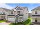 Two-story house featuring a well-maintained lawn and a charming front porch at 2177 Campbell, Burlington, NC 27215