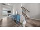 Welcoming foyer featuring wood floors, an elegant staircase, and a stylish blue accent table at 2177 Campbell, Burlington, NC 27215