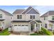 Charming two-story home with a two-car garage and lovely front porch with decorative wreath at 2177 Campbell, Burlington, NC 27215