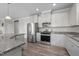 Modern kitchen with granite countertops, stainless steel appliances, and white cabinetry at 2177 Campbell, Burlington, NC 27215
