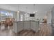 Kitchen island with granite countertops and seating, open to the living and dining areas at 2177 Campbell, Burlington, NC 27215