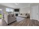 Bright living room featuring a fireplace, hardwood floors, and comfortable seating arrangements at 2177 Campbell, Burlington, NC 27215