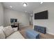 Modern living area featuring comfortable seating and a wall-mounted TV at 2177 Campbell, Burlington, NC 27215