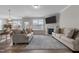 Open concept living room with wood floors, a fireplace, and neutral decor perfect for entertaining at 2177 Campbell, Burlington, NC 27215