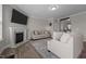 Comfortable living room with a fireplace, hardwood floors, and neutral decor at 2177 Campbell, Burlington, NC 27215