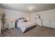 Beautiful bedroom with stylish gray headboard, bedside tables, and a decorative wall at 2713 Jazzy St, New Hill, NC 27562