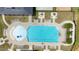 Aerial view of the community pool featuring lounge chairs, tables and umbrellas, and sparkling clean water at 2713 Jazzy St, New Hill, NC 27562