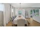 Dining area with modern lighting and views of the outdoor patio at 2713 Jazzy St, New Hill, NC 27562