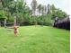 Well-maintained dog park with lush green grass and dog agility equipment for furry friends to play and exercise at 2713 Jazzy St, New Hill, NC 27562