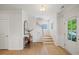 Bright foyer with hardwood floors, staircase, and elegant decor at 2713 Jazzy St, New Hill, NC 27562