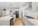 Bright kitchen with stainless appliances, granite countertops, and eat-in island at 2713 Jazzy St, New Hill, NC 27562