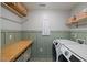 Well-organized laundry room with modern appliances and plenty of storage space at 2713 Jazzy St, New Hill, NC 27562