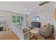 Bright living room with comfortable seating and a seamless transition to the outdoor space at 2713 Jazzy St, New Hill, NC 27562