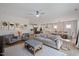 Open-concept living space with modern decor, connecting the living, dining, and kitchen areas at 2713 Jazzy St, New Hill, NC 27562