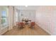 Well-lit home office with stylish decor, a modern desk, and comfortable seating at 2713 Jazzy St, New Hill, NC 27562