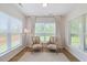 Cozy sitting room with two armchairs, natural light, and a neutral color palette at 2713 Jazzy St, New Hill, NC 27562