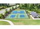 Aerial view of the community basketball and pickleball courts with a covered picnic area nearby at 2713 Jazzy St, New Hill, NC 27562