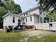 Exterior of home featuring a backyard with patio area, grill, fence, and multi-level porch at 275 Gholson Ave, Henderson, NC 27536