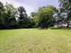 Expansive backyard provides ample space for recreation and relaxation at 275 Gholson Ave, Henderson, NC 27536