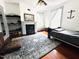 Bright bedroom boasts hardwood floors and a fireplace at 275 Gholson Ave, Henderson, NC 27536