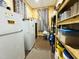 Well-organized pantry featuring ample shelving, multiple refrigerators, and storage for food and supplies at 275 Gholson Ave, Henderson, NC 27536