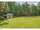 Backyard with shed and fire pit area at 300 Williamston Ridge Dr, Youngsville, NC 27596