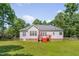 Back exterior view of home with deck and yard at 300 Williamston Ridge Dr, Youngsville, NC 27596