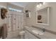 Full bathroom includes a large vanity, mirror, and shower-tub combination at 300 Williamston Ridge Dr, Youngsville, NC 27596