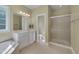 Bathroom includes a tub, shower, and a vanity with sink at 300 Williamston Ridge Dr, Youngsville, NC 27596