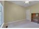 Neutral carpeted bedroom with natural light and a ceiling fan at 300 Williamston Ridge Dr, Youngsville, NC 27596
