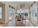 Bright dining area features wood floors, table with seating and direct access to the outdoor deck at 300 Williamston Ridge Dr, Youngsville, NC 27596