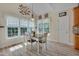 Cozy dining area with table, chairs, and large windows for natural light at 300 Williamston Ridge Dr, Youngsville, NC 27596