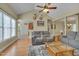 Open living room with hardwood floors flowing into kitchen and dining area at 300 Williamston Ridge Dr, Youngsville, NC 27596