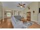 Bright living room featuring vaulted ceilings, hardwood floors, and comfortable gray sofas at 300 Williamston Ridge Dr, Youngsville, NC 27596