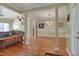 Open floorplan with hardwood floors, crown molding and columned entryway to dining room at 300 Williamston Ridge Dr, Youngsville, NC 27596