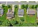An aerial view of a landscaped property with a well-maintained backyard and patio at 304 Forbes Rd, Wake Forest, NC 27587