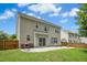 Spacious backyard with a stone patio and a lush lawn at 304 Forbes Rd, Wake Forest, NC 27587