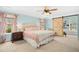 Cozy bedroom with a ceiling fan, a barn-style door and a light and airy ambiance at 304 Forbes Rd, Wake Forest, NC 27587