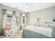 Cozy bedroom featuring a unique hanging chair, vanity, and ample natural light at 304 Forbes Rd, Wake Forest, NC 27587