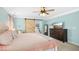 Charming bedroom with a stylish barn door, ceiling fan, and plenty of space at 304 Forbes Rd, Wake Forest, NC 27587